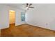 Comfortable bedroom with a ceiling fan, window, and walk-in closet for ample storage at 2750 King Oak Cir, St Cloud, FL 34769
