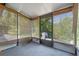 Screened-in porch providing outdoor seating, with a view to the backyard at 2750 King Oak Cir, St Cloud, FL 34769