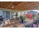 Spacious covered deck with ceiling fans, a variety of seating and views of the yard at 2801 Sw 139Th St, Ocala, FL 34473