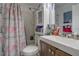 Functional bathroom with a white sink, a bathtub and shower, and a cabinet for storage at 2801 Sw 139Th St, Ocala, FL 34473