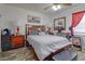 Inviting bedroom featuring a bed, ceiling fan, wood-look flooring, and a modern decor at 2801 Sw 139Th St, Ocala, FL 34473