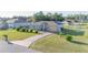 Lovely single-story home featuring a long driveway and a well-manicured front lawn at 2801 Sw 139Th St, Ocala, FL 34473