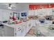 Bright kitchen with white cabinets, stainless steel appliances, and an island with seating at 2801 Sw 139Th St, Ocala, FL 34473