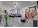 Cozy living room featuring light gray wood flooring, a ceiling fan, and stylish decor at 2801 Sw 139Th St, Ocala, FL 34473