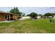 This backyard has a grassy area, patio and lounge seating at 331 Greens End St, Orlando, FL 32810