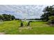 A verdant backyard featuring a view of the river and chairs at 331 Greens End St, Orlando, FL 32810