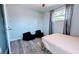 Small bedroom with new flooring, window, and two soft beanbag chairs for children to enjoy at 331 Greens End St, Orlando, FL 32810