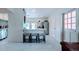 Bright, open kitchen featuring white cabinets, modern appliances, a breakfast bar and a tiled floor at 331 Greens End St, Orlando, FL 32810
