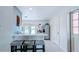 Clean white kitchen with stainless steel appliances, breakfast bar, and access to the outdoor space at 331 Greens End St, Orlando, FL 32810