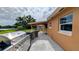 A large stainless steel grill sits next to an outdoor kitchen and covered eating area at 331 Greens End St, Orlando, FL 32810