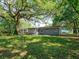 Backyard featuring large shady trees at 3524 Amigos Ave, Orlando, FL 32808