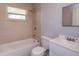 Clean bathroom features tiled walls and shower over tub at 3524 Amigos Ave, Orlando, FL 32808