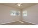 Bright bedroom features wood-look floors and dual windows at 3524 Amigos Ave, Orlando, FL 32808