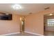 Open living room featuring wood-look floors and access to other rooms at 3524 Amigos Ave, Orlando, FL 32808