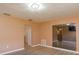 Living room featuring wood-look floors and access to other rooms at 3524 Amigos Ave, Orlando, FL 32808