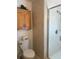 Bathroom featuring a toilet, shower stall with glass door, and vanity with storage cabinet at 361 Dreama Dr, Davenport, FL 33897
