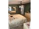 Cozy bedroom featuring a ceiling fan, mirrored closet, and a comfortable bed with decorative quilt at 361 Dreama Dr, Davenport, FL 33897
