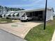 A single Gathering home with driveway, carport, and golf cart parking at 361 Dreama Dr, Davenport, FL 33897