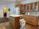 Well lit kitchen with wood cabinets and an island for added convenience at 361 Dreama Dr, Davenport, FL 33897