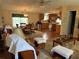 Cozy living room with adjacent kitchen and dining area offers a comfortable and connected living space at 361 Dreama Dr, Davenport, FL 33897