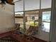 Bright sunroom offers tile flooring and comfortable chairs providing relaxing indoor-outdoor living at 361 Dreama Dr, Davenport, FL 33897