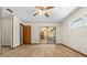 Bedroom with light wood floors and sliding glass door to an outdoor space at 3942 Orange Lake Dr, Orlando, FL 32817