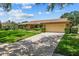Charming single-story home featuring a well-manicured lawn and long driveway at 3942 Orange Lake Dr, Orlando, FL 32817