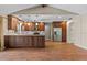 Spacious kitchen area with wood floors, wood cabinets, and stainless steel appliances at 3942 Orange Lake Dr, Orlando, FL 32817
