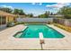 Enjoy this backyard pool with diving board, surrounded by a concrete deck and privacy fence at 3942 Orange Lake Dr, Orlando, FL 32817