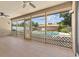 Screened porch with view of a sparkling swimming pool and backyard oasis at 3942 Orange Lake Dr, Orlando, FL 32817