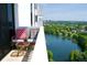 Relaxing balcony with comfortable seating and serene views of a tranquil lake and lush greenery at 400 E Colonial Dr # 1609, Orlando, FL 32803