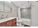 Cozy bathroom with marble vanity, and decorative tile accents surrounding the tub and shower at 400 E Colonial Dr # 1609, Orlando, FL 32803