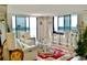 Bright living room features floor to ceiling windows, stylish furniture, and a stunning view at 400 E Colonial Dr # 1609, Orlando, FL 32803