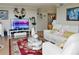 Inviting living room with hardwood floors, comfortable seating, and large windows offering plenty of natural light at 400 E Colonial Dr # 1609, Orlando, FL 32803