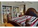 Spacious main bedroom featuring a decorative wooden bed frame, shelving unit, and cozy atmosphere at 400 E Colonial Dr # 1609, Orlando, FL 32803