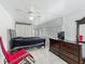 Bedroom with large closet, ceiling fan, windows, and dresser, offering ample storage and natural light at 4021 Queen Anne Dr, Orlando, FL 32839
