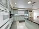 Well-lit kitchen features stainless steel appliances, ample counter space, and modern cabinetry at 4021 Queen Anne Dr, Orlando, FL 32839