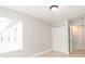 Bright bedroom features a neutral color, a large closet, a window, and tiled floors at 4528 Commander Dr # 2033, Orlando, FL 32822