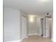Neutral bedroom showcasing a tiled floor, two doors, and a closet at 4528 Commander Dr # 2033, Orlando, FL 32822