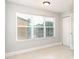 Sunlit bedroom showcases a large window, closet, and neutral color palette at 4528 Commander Dr # 2033, Orlando, FL 32822