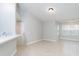 Bright, open living area with neutral tones, tile flooring, and easy kitchen access at 4528 Commander Dr # 2033, Orlando, FL 32822