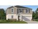 Charming two-story home featuring gray siding, a two-car garage, and a welcoming front entrance at 4701 Katrina Dr, Haines City, FL 33844