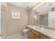 Bathroom with modern vanity, neutral wall color, and window with curtains at 476 Basking Ridge Ct, Ocoee, FL 34761