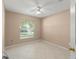 Bedroom with tile flooring, neutral paint and a window letting in natural light at 476 Basking Ridge Ct, Ocoee, FL 34761