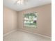 Bedroom with tile floor, neutral paint, a ceiling fan, and a window at 476 Basking Ridge Ct, Ocoee, FL 34761