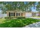 Charming single-Gathering home featuring an attached two car garage, manicured lawn and mature landscaping at 476 Basking Ridge Ct, Ocoee, FL 34761
