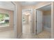 Hallway view showcasing access to the bath, bedrooms, and living spaces with tile floor at 476 Basking Ridge Ct, Ocoee, FL 34761