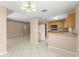 Open kitchen with breakfast bar, wood cabinets, and modern appliances at 476 Basking Ridge Ct, Ocoee, FL 34761