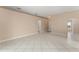 Spacious living area with neutral paint, and tile flooring throughout the open-concept layout at 476 Basking Ridge Ct, Ocoee, FL 34761