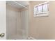 Shower with white tile surround and convenient built-in seat at 476 Basking Ridge Ct, Ocoee, FL 34761
